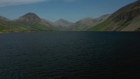 4K:  Drone Aerial Clip of Wastwater Lake in the English Lake District, Cumbria, UK. Tilt up shot in Summer with Blue Sky. Stock Video Clip Footage