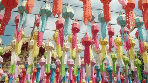Colorful lanterns Lanna style during Loy Krathong festival in northern of Thailand on blue sky background. 
