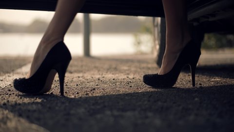 Businesswoman Slim Sexy Legs In High Heels Shoes Get Out Luxury Car.Indуpendend Elegant Woman Open Door Leaving Automobile SUV.Woman In High Heels Getting Out Of Car.Elegant Lady Legs In Heels In Auto