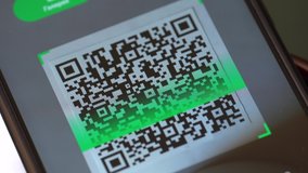 Scanning a QR code. Smartphone screen close up. The app scans the QR code. Checking the QR code of the vaccination certificate - Powered by Shutterstock - Get 15% off with code: PIKWIZARD15