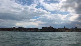 Beautiful Venetian lagoon filmed in spring season.Popular travel destination in Metropolitan City of Venice in Italy.Ancient town Venezia,Italia.Royalty free 4K video clip filmed in famous landmark