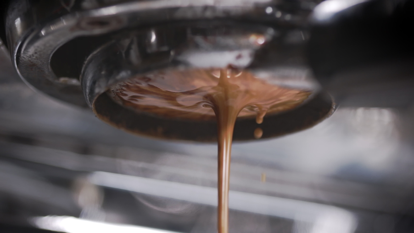 Perfect espresso pull. Creamy and perfectly pulled shot of espresso. Coffee shop artisan at work. Shot in 4k.  Royalty-Free Stock Footage #1061335981