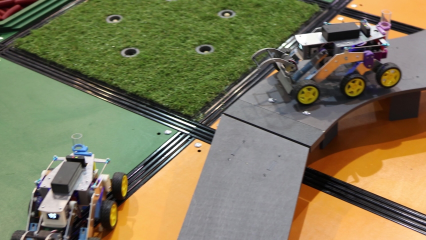 Homemade robot on wheels with eyes. Hobby robotics.