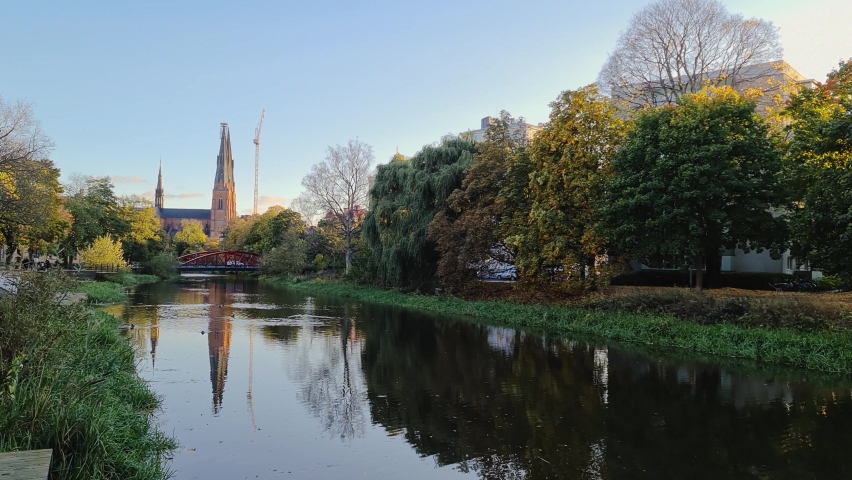 Gorgeous view on town street with cathedral on background in autumn day. Tourism, travel concept. Europe, Sweden, Uppsala.
