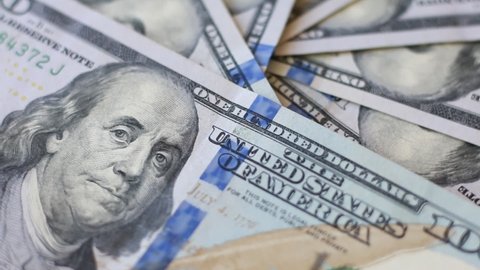Rotating US dollars banknotes - close-up view