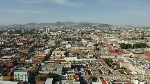 Mexico City Neighborhood. Mountains in Background CDMX.Drone, Boom.Jib Down