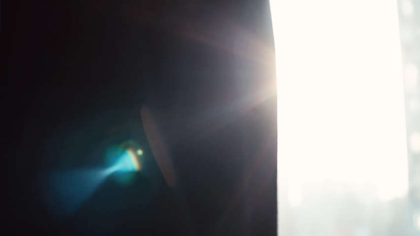 Close-up of two colleagues shaking hands in the office against the background of a window and sunbeam. Tracking shot in slow motion. Royalty-Free Stock Footage #1061344135