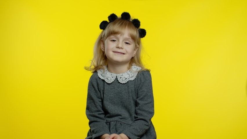 Inscription advertising Up To 30 Percent Off appears next to smiling kid girl. Teen pupil celebrating, showing thumbs up, looking satisfied with low prices, discounts, shopping on Black Friday