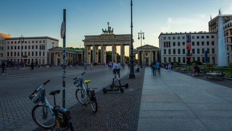 Iconic Brandenburg Gate In Berlin, Germany Hyperlapse with turist passing by