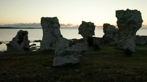 Establishing shot of Rauks sea stacks, limestones, in Gotland, Sweden,