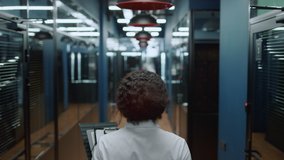 African businesswoman walking in business center corridor. Closeup african american woman going on meeting in office hallway. Back view afro business woman walking on meetup in corridor. - Powered by Shutterstock - Get 15% off with code: PIKWIZARD15