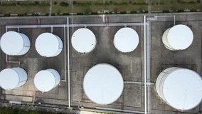Drone aerial view oil And gas petrochemical industrial and oil storage tank. Oil station and gasoline tank on the ground drone flying over industrial oil storage refinery concept video, Shanghai China