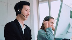 Business people wearing headset working in office to support remote customer or colleague. Call center, telemarketing, customer support agent provide service on telephone video conference call.