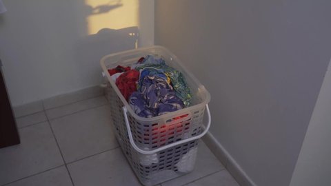 Tons of laundry - laundry preparation. Dirty clothes in laundry basket. Basket for dirty Laundry. mix clothing thrown into the basket.