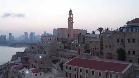 Aerial view of Jaffa old city port at sunrise with marina coastline and general view of both Jaffa and Tel Aviv.