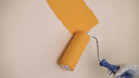Cosmetic repair of the premises. Painting the wall orange