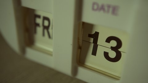 The clock showing Friday the 13th date