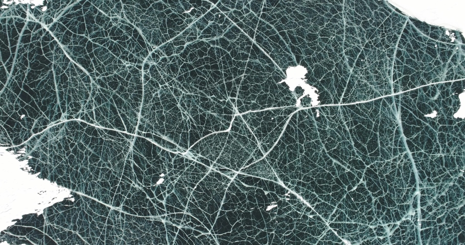 Lake Baikal in winter. The abstract and dense lines of ice. A popular travel destination in Russia. Aerial view of the ice.