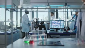 Medical Science and Biotechnology Laboratory with Diverse Team of Research Scientists Working. Microbiologist and Biochemist Talking, Using Digital Tablet Computer and Micropipette. Dolly Slow Motion - Powered by Shutterstock - Get 15% off with code: PIKWIZARD15