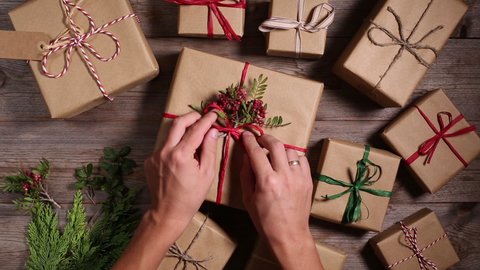 Creative zero waste Christmas concept. Wrapping gift boxes in handmade eco friendly craft paper. Seasonal, holidays, New Year decoration.