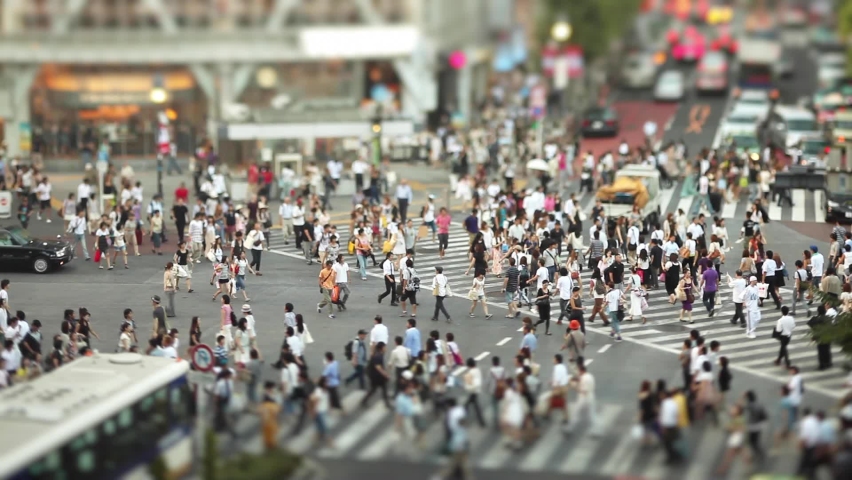 The famous Shibuya Crossing in Tokyo Japan with it's crowds of people, shot with a tilt-shift lens Royalty-Free Stock Footage #1061391976