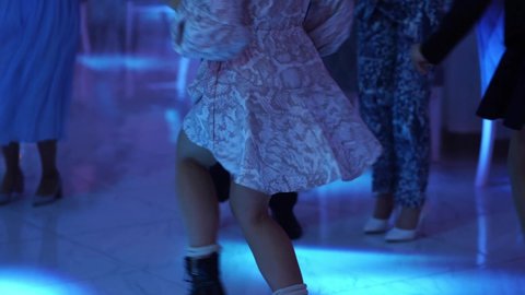 young woman in a short skirt dancing at a disco. sexy dance.