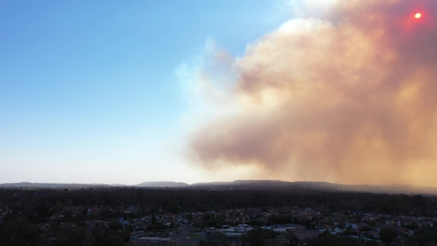 Aerial pan of California Wildfire Smoke Covering Middle class Neighborhoods During the Silverado Fire_02