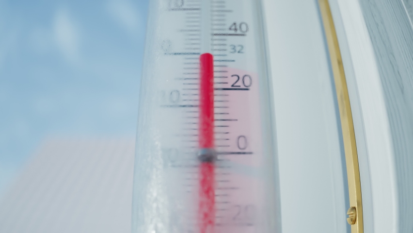 The thermometer outside the window shows rising temperature while seasons changing. The mercury column climbing above 50 celsius in the sun. From cold winter to warm summer. Wheater measurements.
 Royalty-Free Stock Footage #1061405230