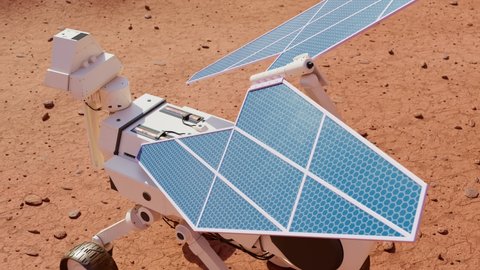 Planetary rover charging batteries while exploring the red planet. The solar power robot stops in the terrain. The test vehicle having a break during the measurements. The mission of Mars exploration.