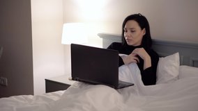 Happy and relaxed women watching video movie to laptop 