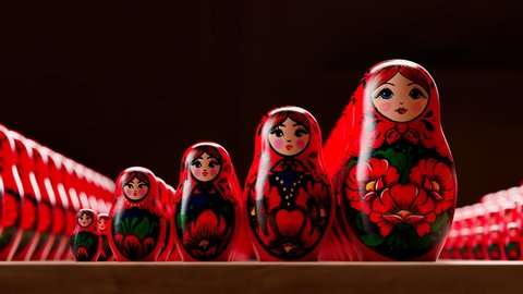 Beautiful handmade matryoshka dolls. Set of traditional wooden Russian toys of increasing size. An animation shows placing one of babushka inside others. Infinity number of art souvenir painted. Loop.