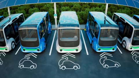 Electric cars charging station. Minibuses stopped at the parking to charge the batteries. Concept of the environment-friendly car. Electric cars are plugging into electricity. Electromobility.
