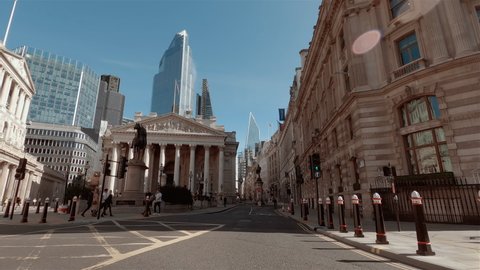 LONDON, circa 2020 - The Impact of COVID-19 / CORONAVIRUS in the City of London. The financial hub of London, aka The Square Mile, is now a desolate place, left to occasional pedestrians and cyclists