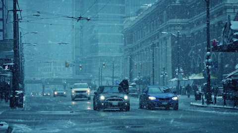 Vehicles On City Road In Snow Storm
