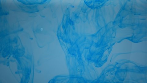 One ink flow, infusion blue dye cloud or smoke, ink inject on white in slow motion. Blue tint splatter in water. Inky background 