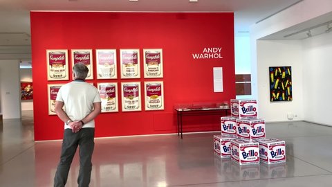 Bratislava, Slovakia - 10/22/2020: Senior caucasian man with facial protective mask to observe artworks by Andy Warhol in The Danubiana Meulensteen Art Museum. 4K footage