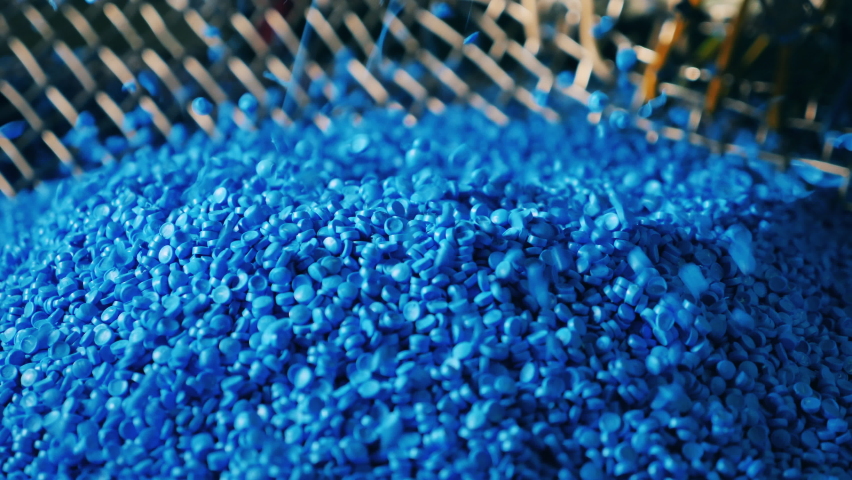 Blue plastic granules raining down | Shutterstock HD Video #1061416147