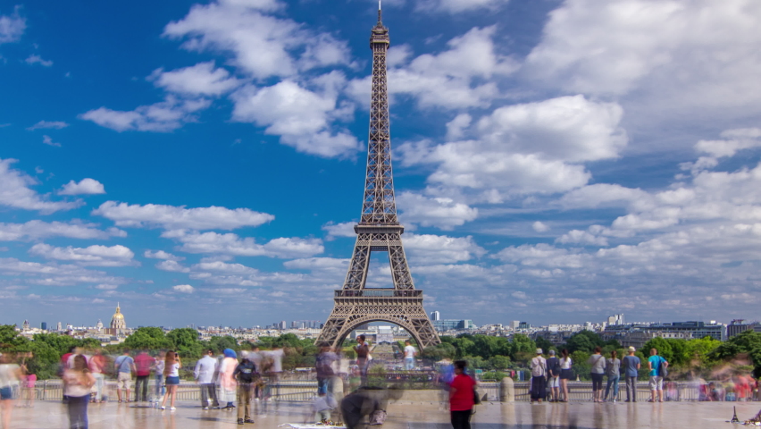 Famous square Trocadero with Eiffel tower in the background timelapse hyperlapse. Trocadero and Eiffel tower are the most visited attractions of Paris. Blue cloudy sky at summer day | Shutterstock HD Video #1061417941