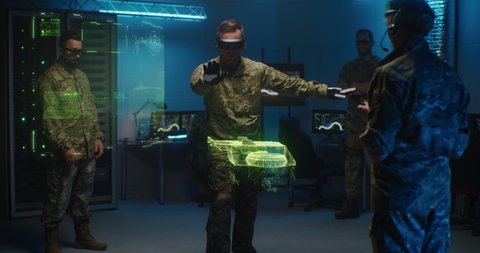 Group of servicemen in VR goggles testing model of military drone in holographic program