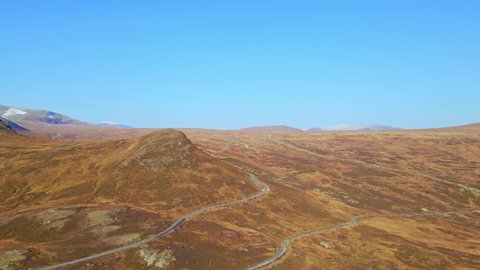 Beitostølen highland plateau and mount Bitihorn in autumn colors. Aerial footage.