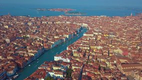 Aerial drone video of iconic and unique Grand Canal crossing city of Venice as seen from high altitude, Italy.