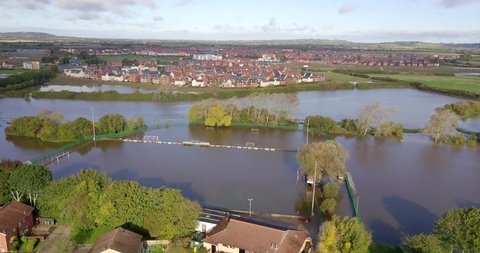 Slow rising aerial shot of flooded football pitch in Aylesbury, UK