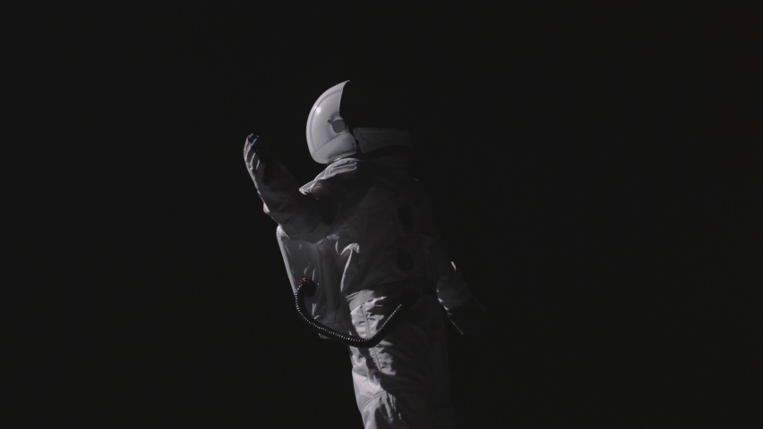 An astronaut in space floating around | Shutterstock HD Video #1061439601