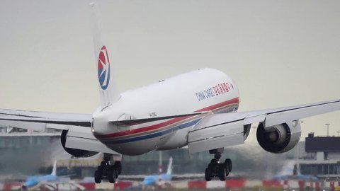 Amsterdam, Netherlands – 1 September 2020: A Boeing 777 of China Cargo landing at Amsterdam Schiphol Airport (AMS) in the Netherlands. Boeing is an Aircraft manufacturer from Seattle, USA.