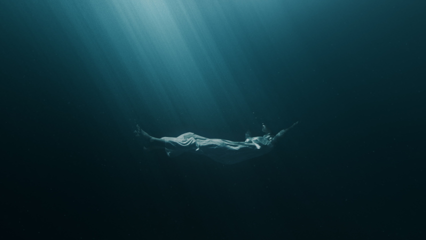 Silhouette Of Depressed Young Woman Sinking In Dark Deep Ocean Underwater Storm Black Water Loneliness Violence Psychological Disorders PTSD Sexual Physical Emotional Abuse Mental Illnes Disease 4K