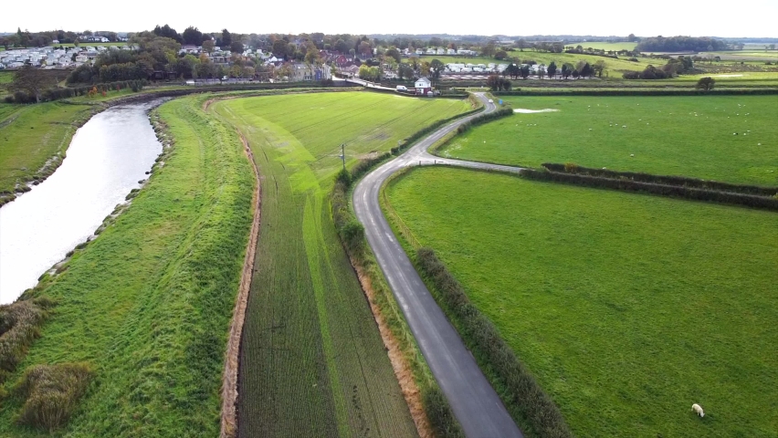 Aerial Drone Shot Ascending Over Country Road & River, Looking Down on Cars (4K)