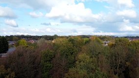 Aerial Overhead Drone Shot Ascending over Trees to Houses in Countryside (4K)