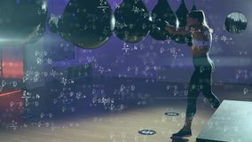 Animation of girl boxing during training over animated background with mathematical equations. Digital composite video