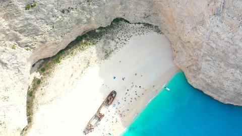 Aerial drone view of iconic beach of Navagio or Shipwreck one of the most beautiful beaches in the world with deep turquoise clear sea, Zakynthos island, Ionian islands, Greece