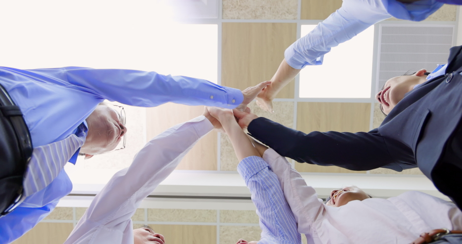 below view of business people give high five with their colleagues after conference meeting